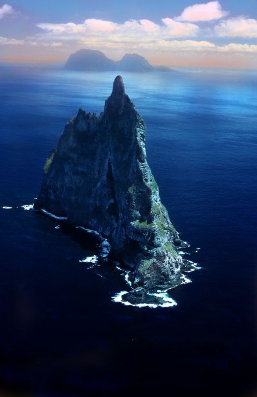 It rises from the waters  of the eastern coast of Australia. Balls Pyramid